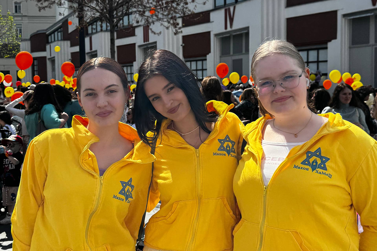 three female students smiling